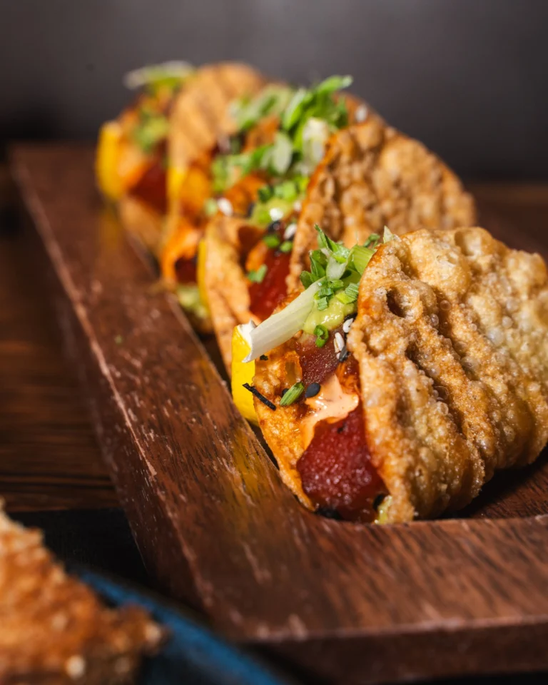 Pressed steak sandwich with chimichurri on a wooden board